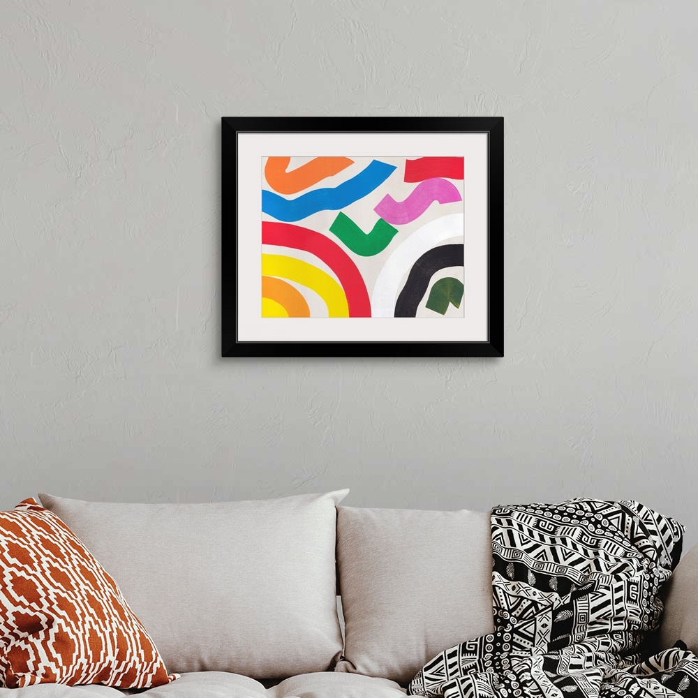 A bohemian room featuring A bright modern abstract painting featuring squiggly lines in primary colors
