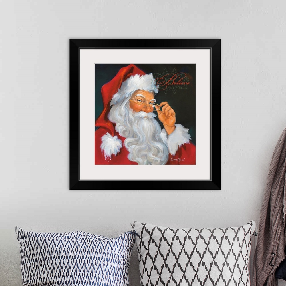 A bohemian room featuring Fine art painting of Santa Claus in a red suit with the word "Believe"  above his head.
