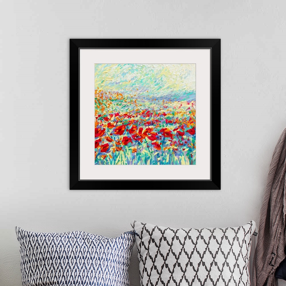 A bohemian room featuring Brightly colored contemporary artwork of a field of red poppies.