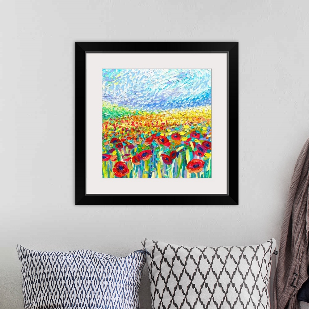 A bohemian room featuring Brightly colored contemporary artwork of a painting of a field of red and yellow poppies.