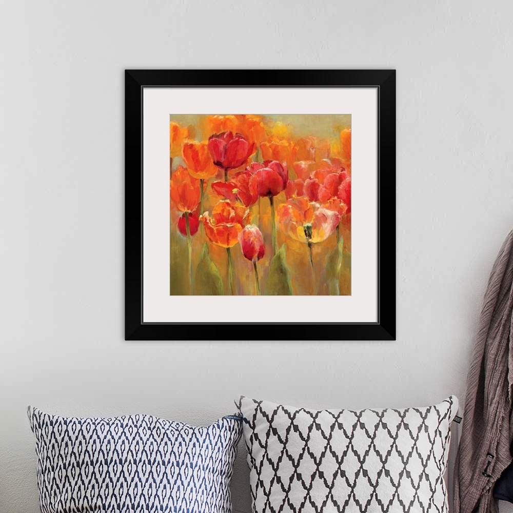 A bohemian room featuring Square painting of tulips with flame colors on a neutral background.