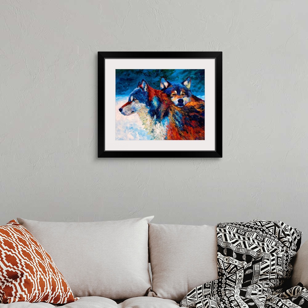 A bohemian room featuring Contemporary painting of two wolves in the snow at night.