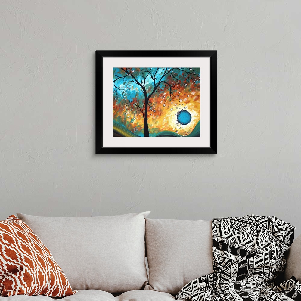 A bohemian room featuring This is an abstract painting of a silhouetted tree in front of a multi-hued psychedelic landscape.