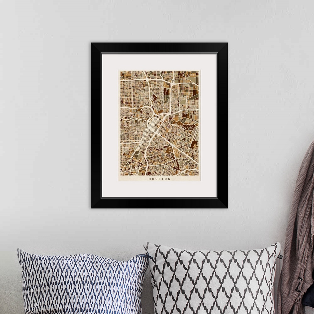 A bohemian room featuring Brown toned city street map artwork of Houston.