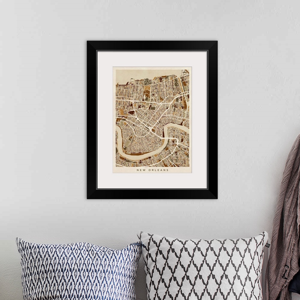 A bohemian room featuring Brown toned city street map artwork of New Orleans.