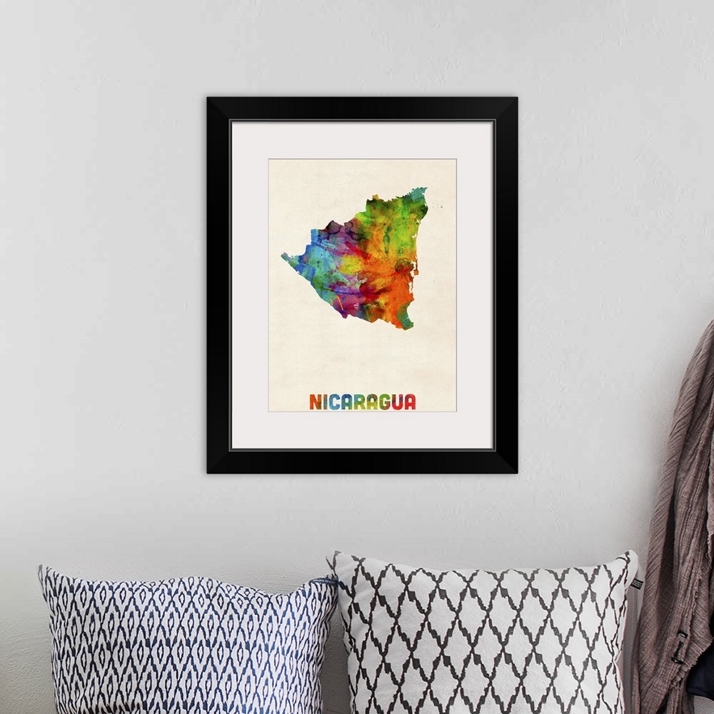 A bohemian room featuring Watercolor art map of the country Nicaragua against a weathered beige background.