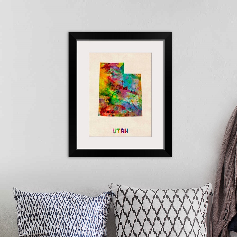 A bohemian room featuring Contemporary piece of artwork of a map of Utah made up of watercolor splashes.