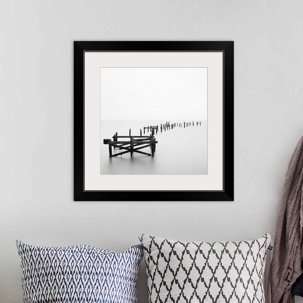 A bohemian room featuring Large photograph focuses on a deteriorating dock sitting alone in a wasteland of fog.