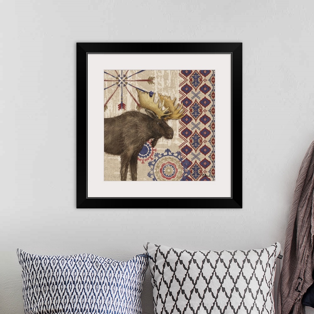 A bohemian room featuring Decorative artwork of a moose with folk patterns and arrows on a wood texture.
