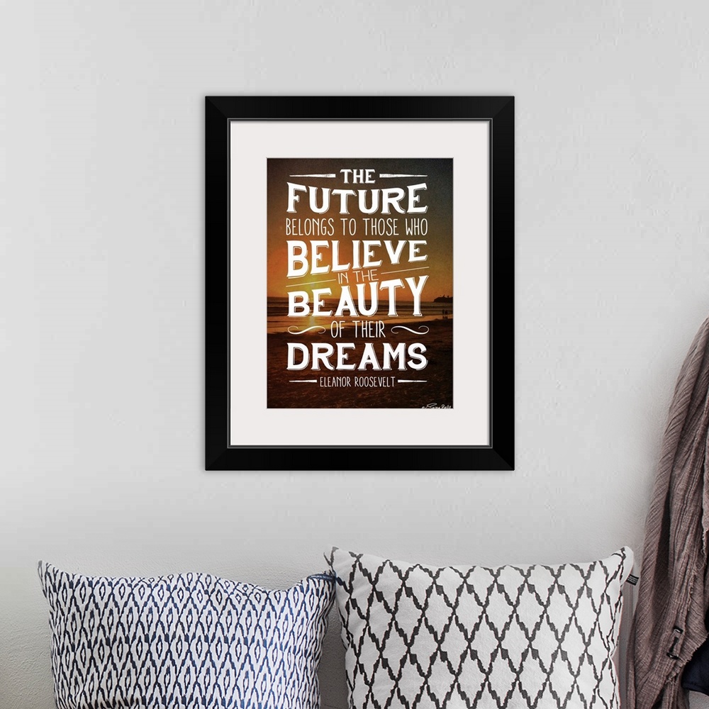 A bohemian room featuring Inspirational quote in white lettering against a photograph of a beach at sunset