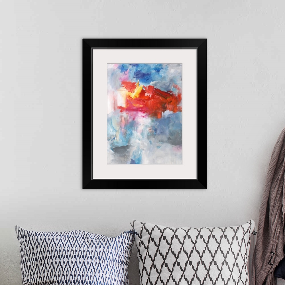 A bohemian room featuring Contemporary abstract painting using bright red tones over a mixture of blue tones over gray.