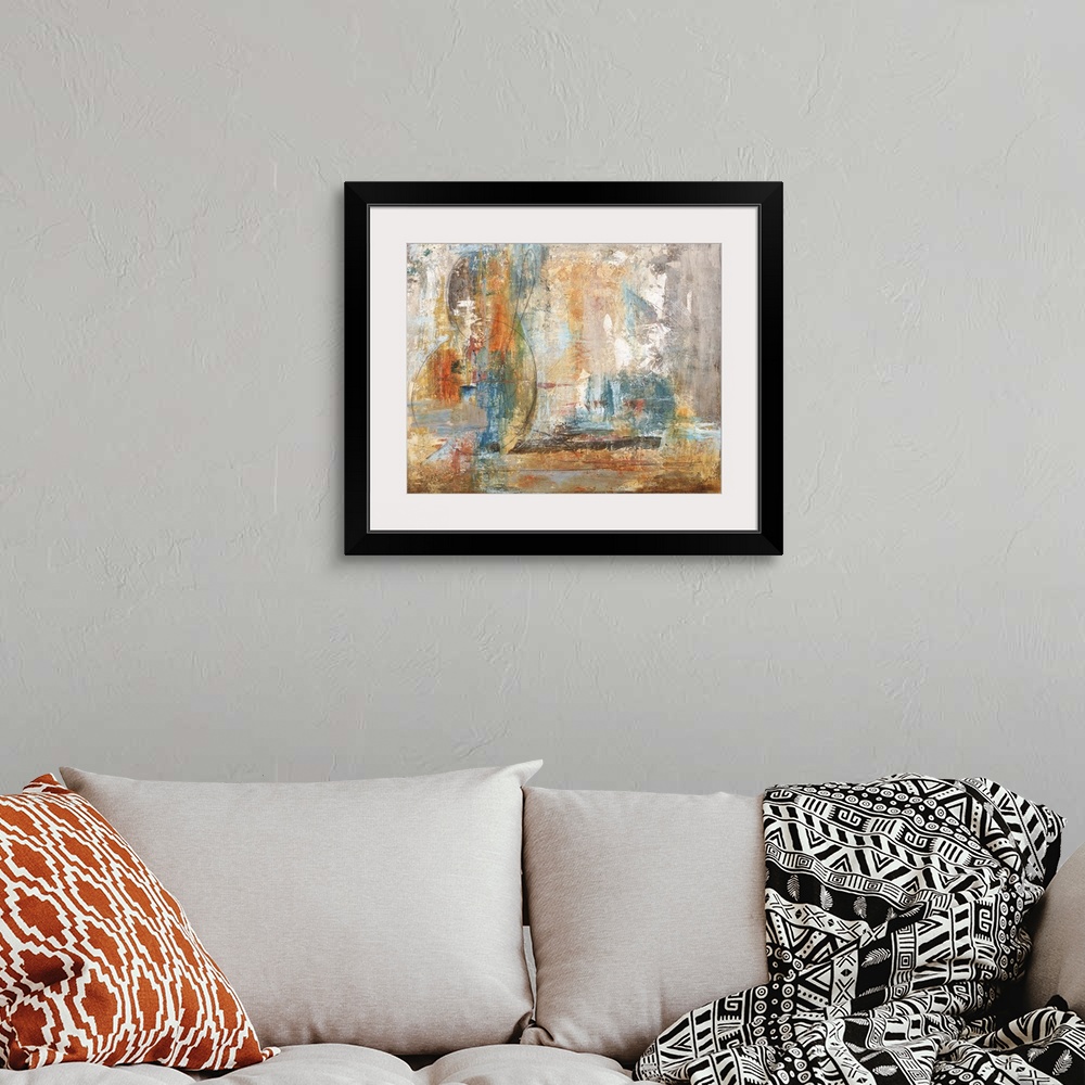 A bohemian room featuring Contemporary abstract painting in orange and blue.