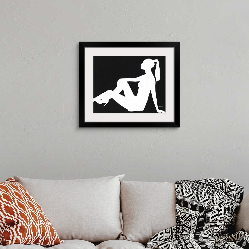 A bohemian room featuring Contemporary painting of a silhouetted female form.