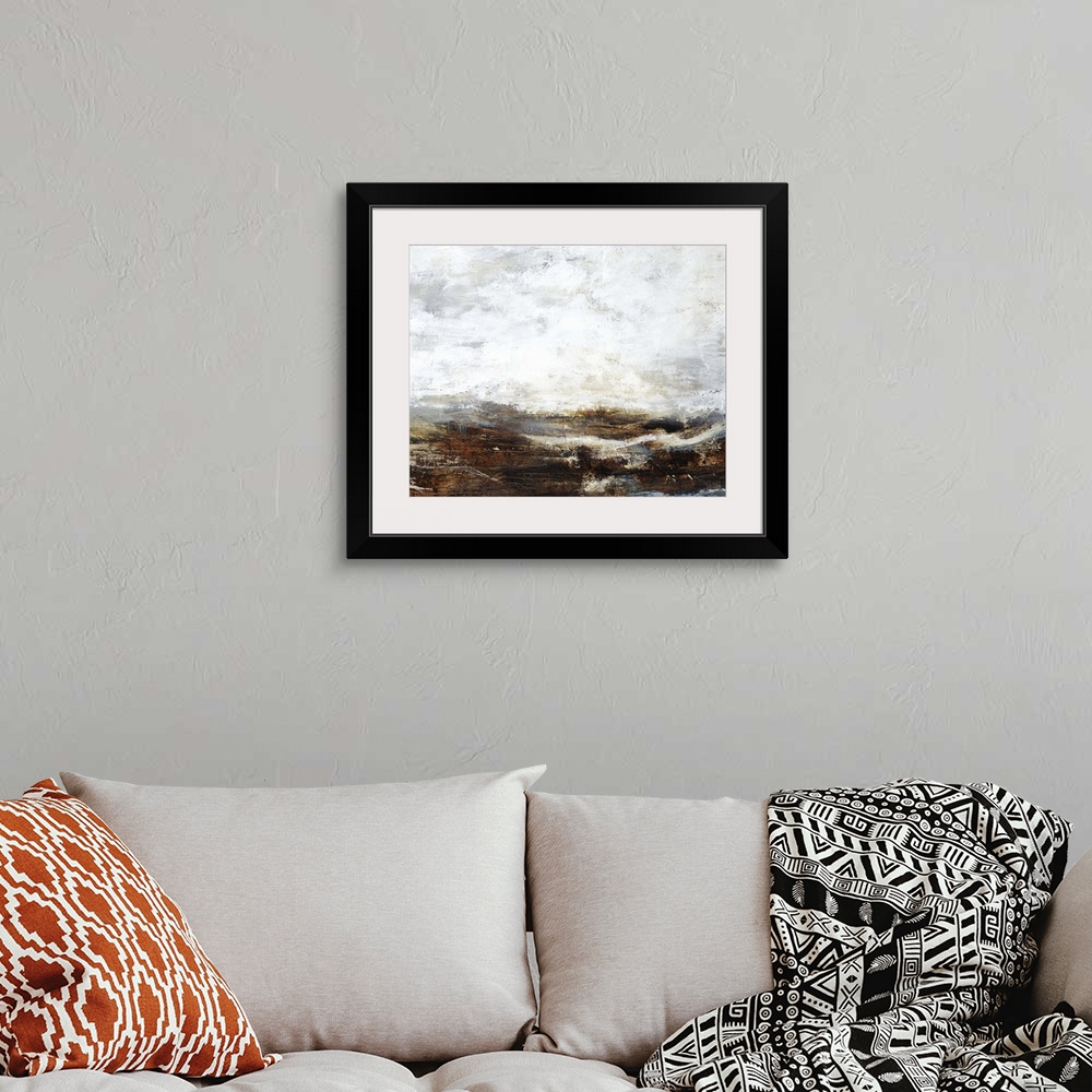 A bohemian room featuring Contemporary painting of a landscape under a heavy fog shrouding the mountains in the distance.
