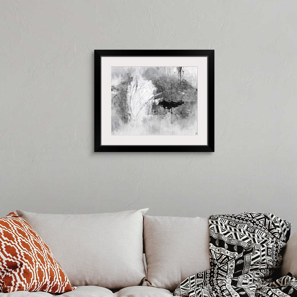 A bohemian room featuring Contemporary abstract artwork in gritty shades of white and grey.