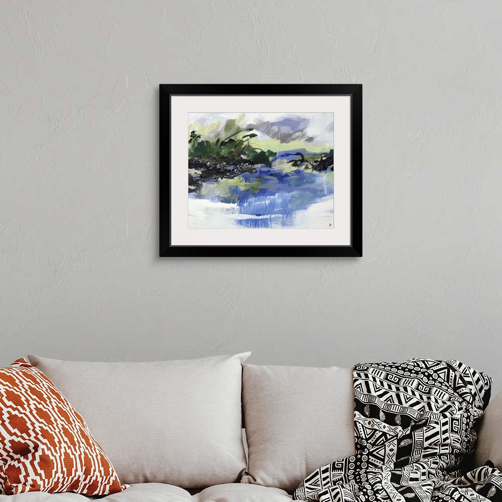 A bohemian room featuring An abstract landscape of a lake surrounded by trees.