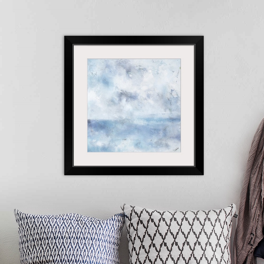 A bohemian room featuring Square abstract painting in shades of blue, gray, and white with a foggy feel.