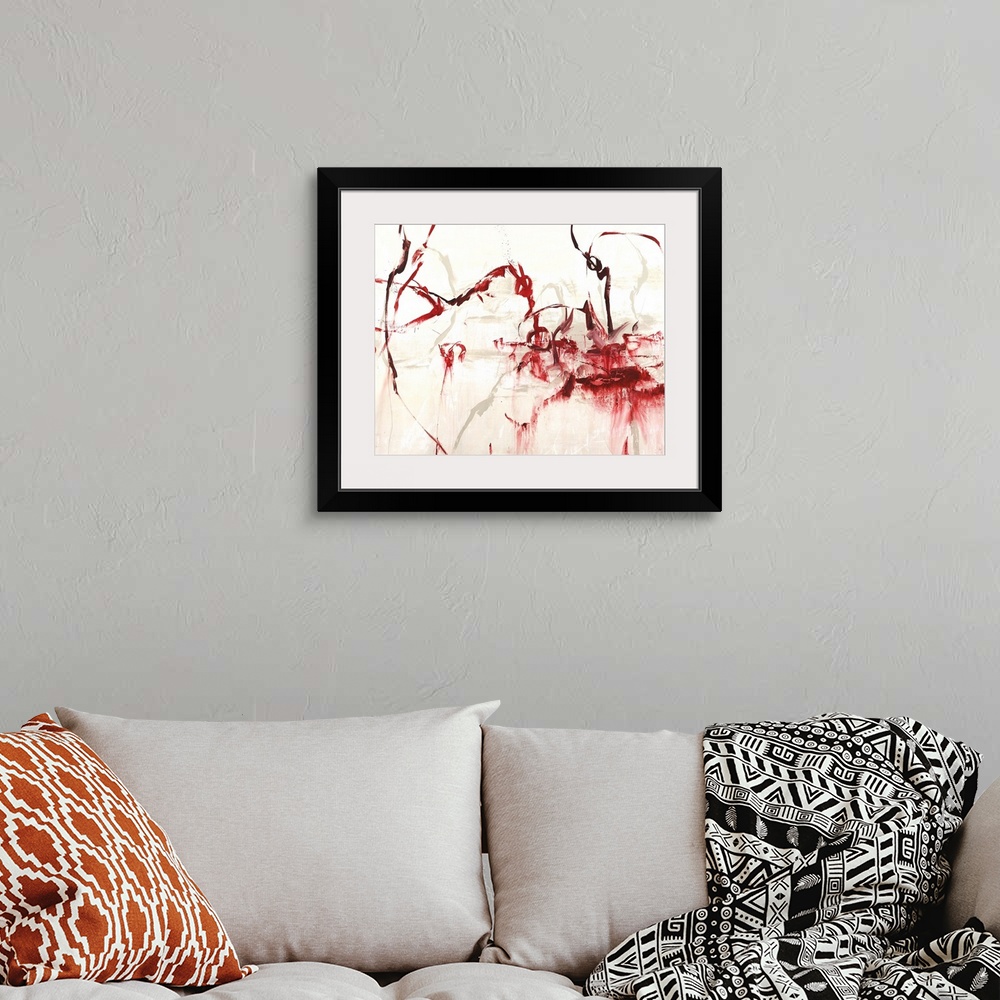 A bohemian room featuring Contemporary abstract painting using vibrant red tones in sinuous forms.