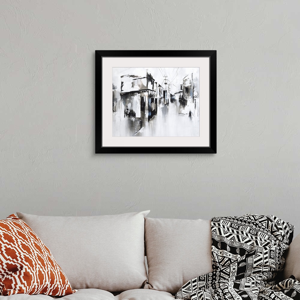 A bohemian room featuring An abstract landscape of a city street of stores and power lines.