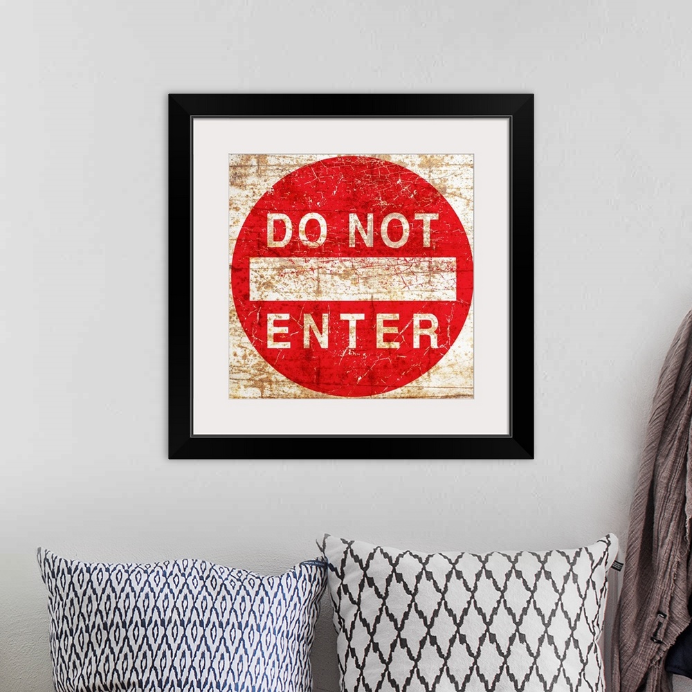 A bohemian room featuring A worn, distressed, cracked and rusty Do Not Enter street sign.