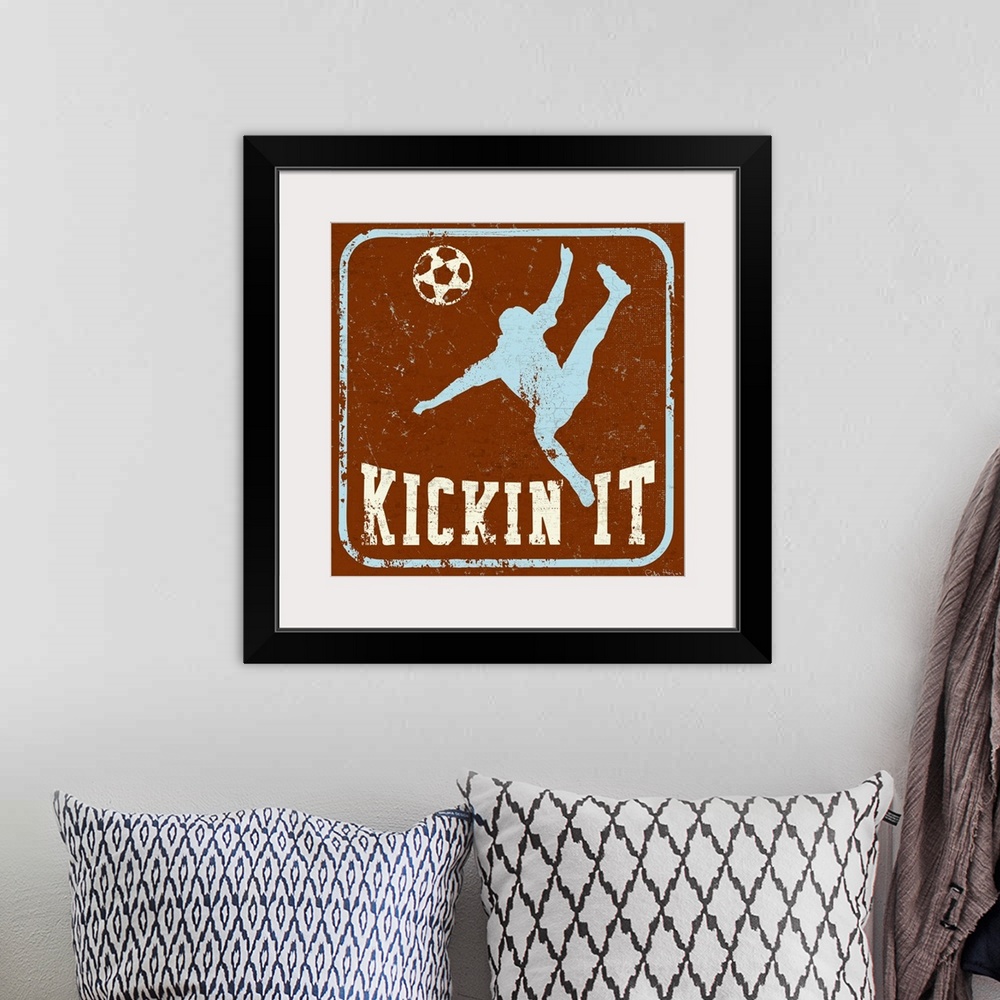 A bohemian room featuring Distressed image of soccer player kicking a soccer ball with the words Kickin' It underneath.