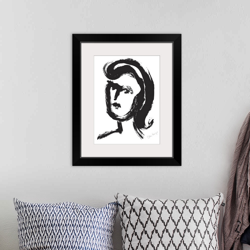 A bohemian room featuring A quick black brush illustration of a young woman's face.
