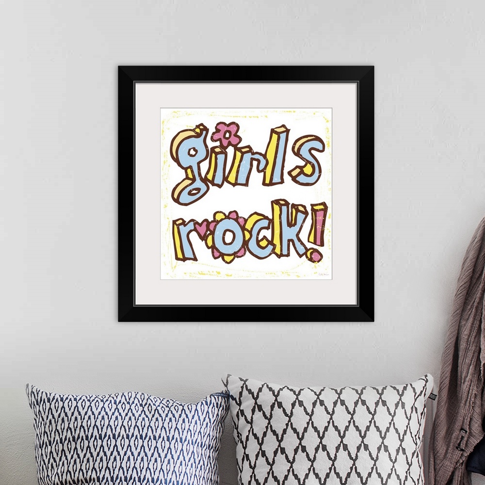A bohemian room featuring The words "Girls Rock" handwritten in pen and ink.