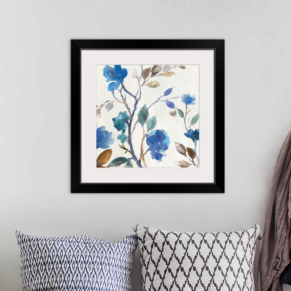 A bohemian room featuring Watercolor decorative artwork of blue flowers with brown and pale green leaves on an off-white ba...