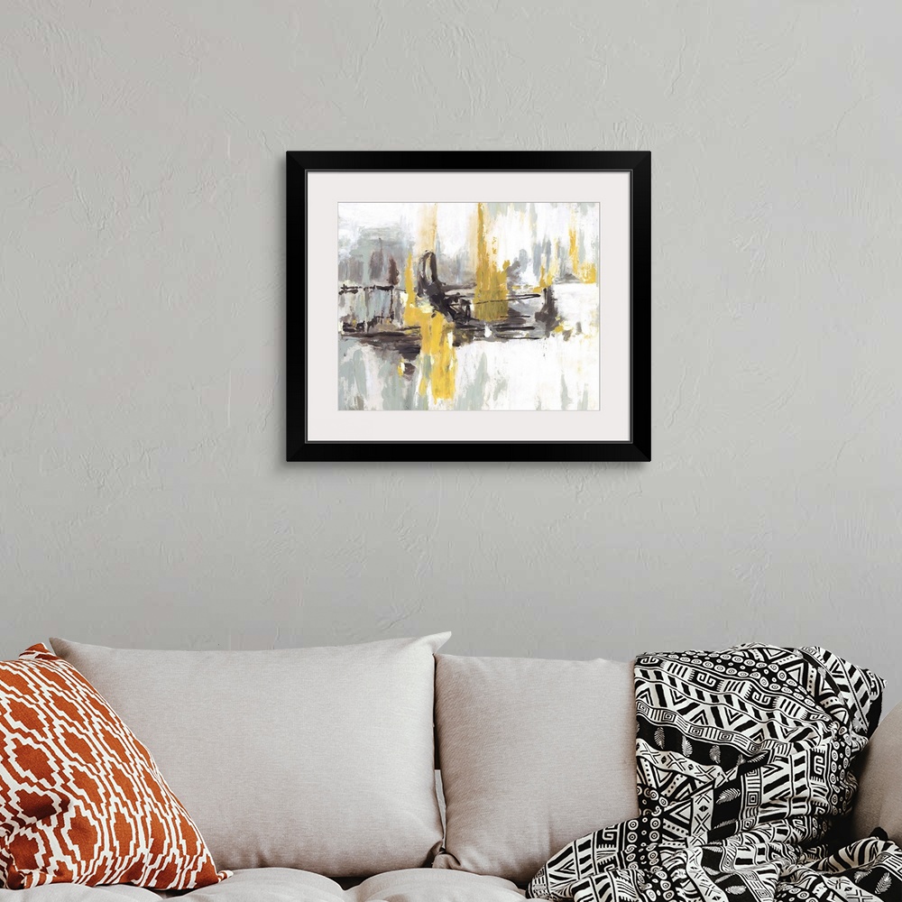 A bohemian room featuring Contemporary abstract artwork in black and white embellished with bright yellow areas.
