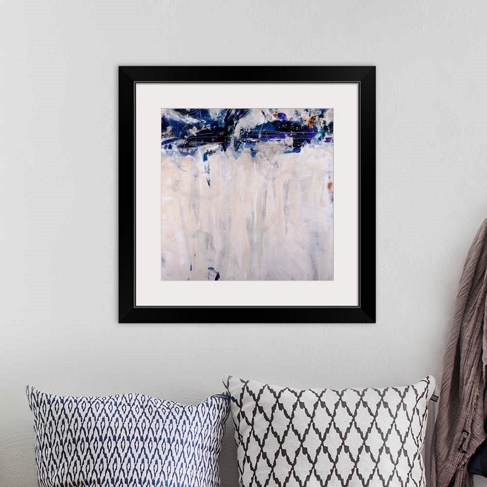 A bohemian room featuring This artwork is a square gicloe print of an abstract painting with dark shapes decorating the top...