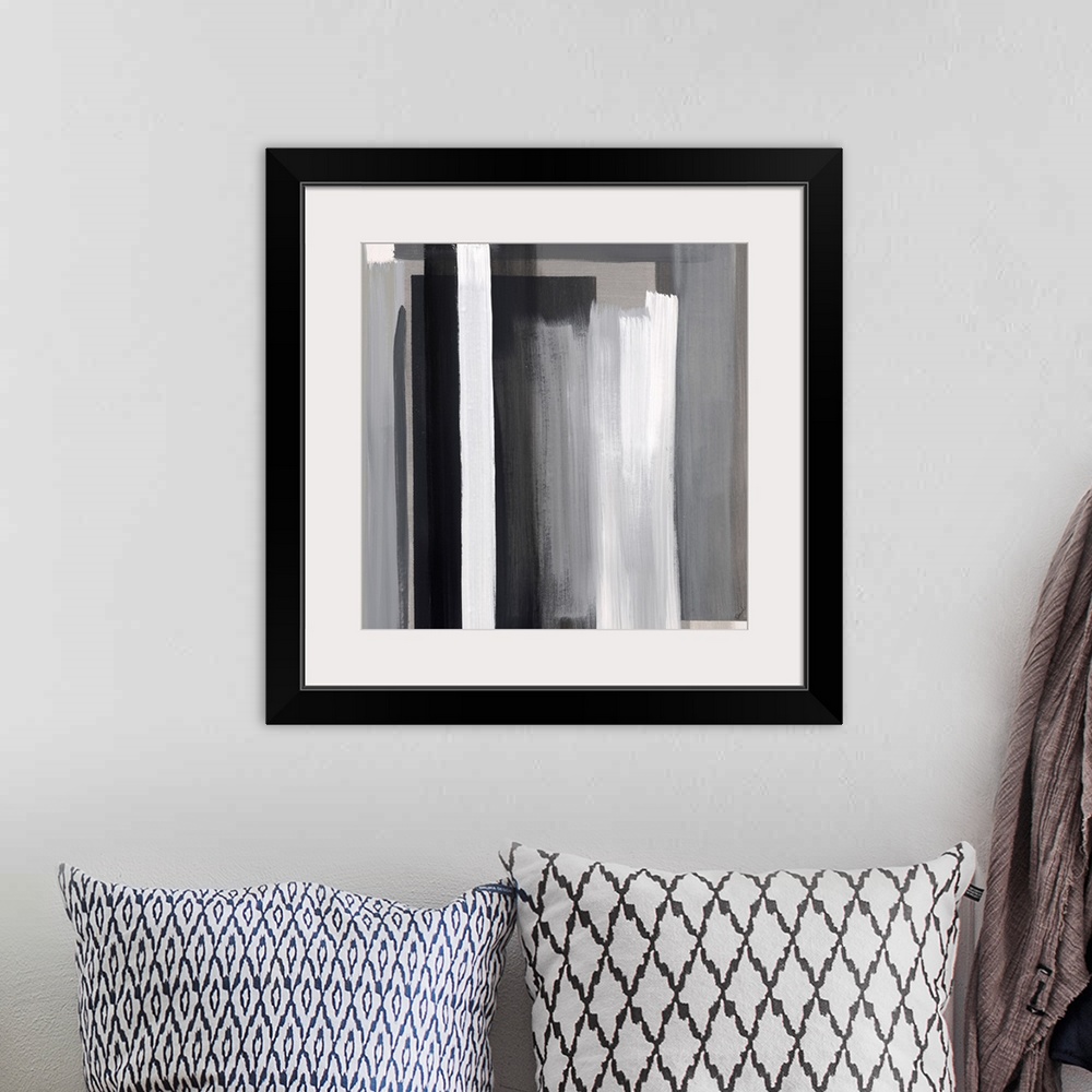 A bohemian room featuring Abstract artwork of layered color blocks in white and black.