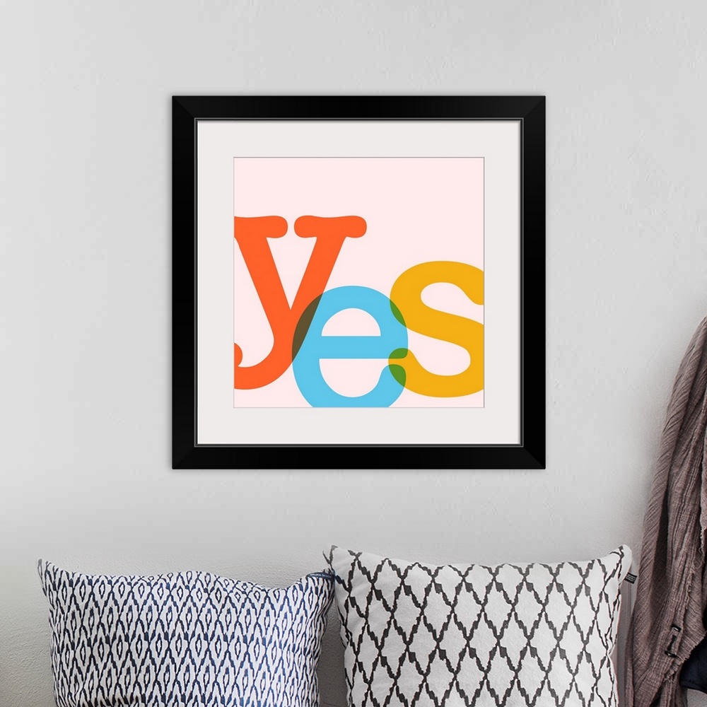 A bohemian room featuring A square modern illustration of the word YES in bright colors.