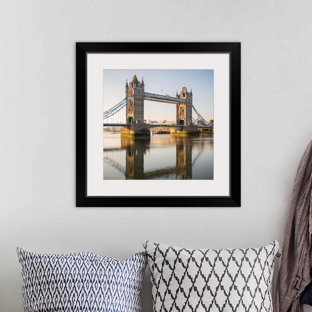 A bohemian room featuring Square photograph of Tower Bridge reflecting into the River Thames in London, England, UK.