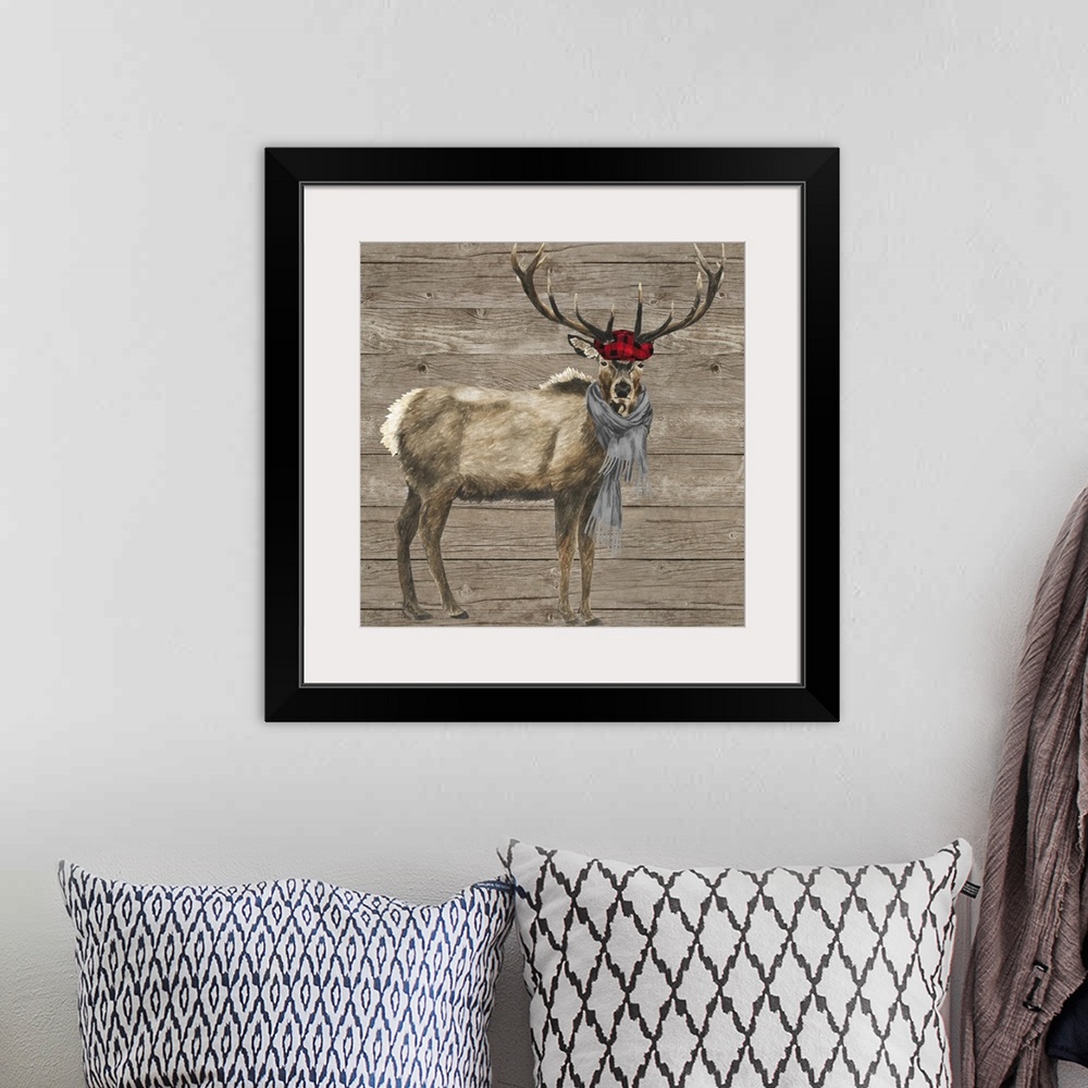 A bohemian room featuring Decorative image of a buck wearing a plaid cap and gray scarf against a wood panel backdrop.
