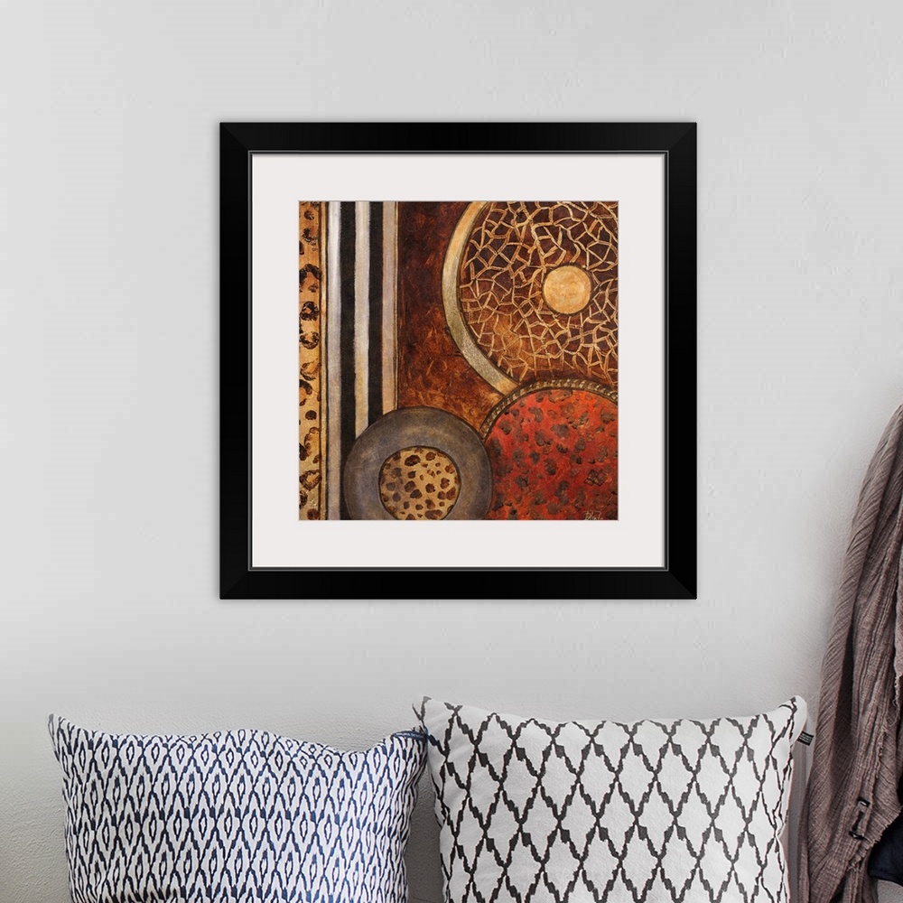 A bohemian room featuring Abstract artwork that consists of three circles each filled with a different animal pattern. Stri...