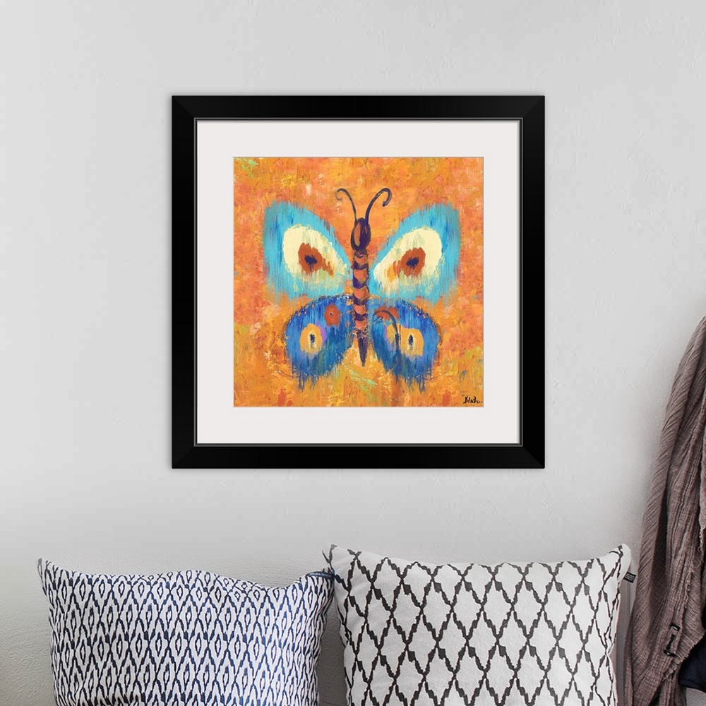 A bohemian room featuring Vivid painting of a butterfly with spotted wings on an orange background.