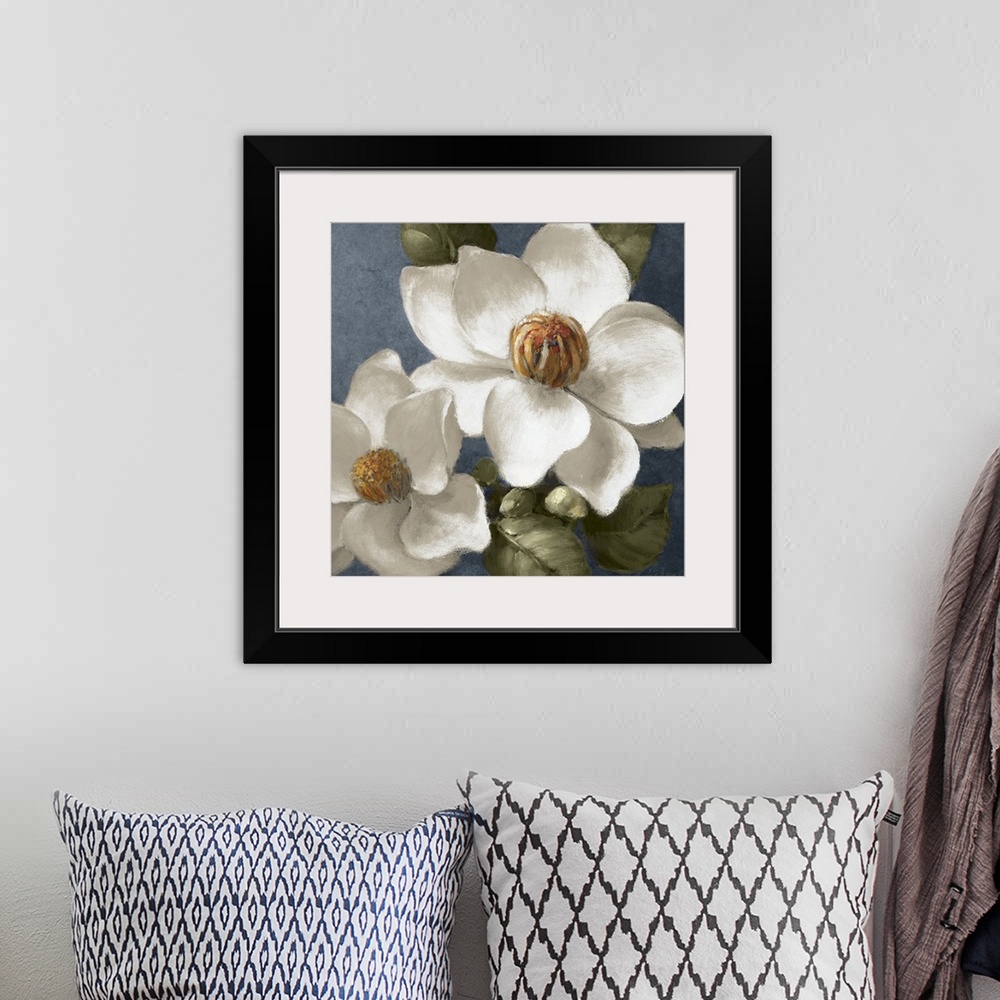 A bohemian room featuring Square floral painting of two fully bloomed magnolia flowers, surrounded by leaves, on a grey blu...