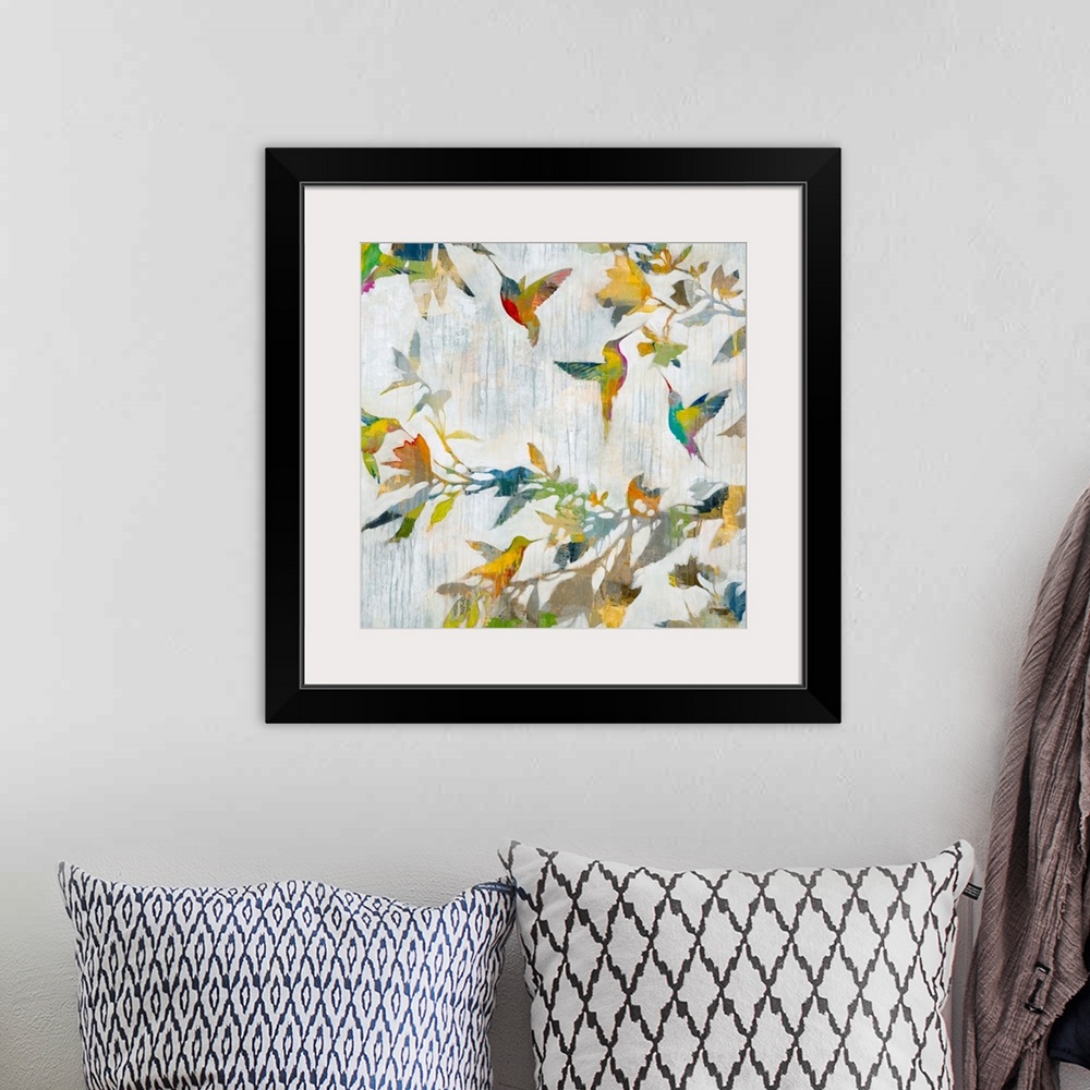 A bohemian room featuring Contemporary abstract painting of a hummingbirds in multiple colors.
