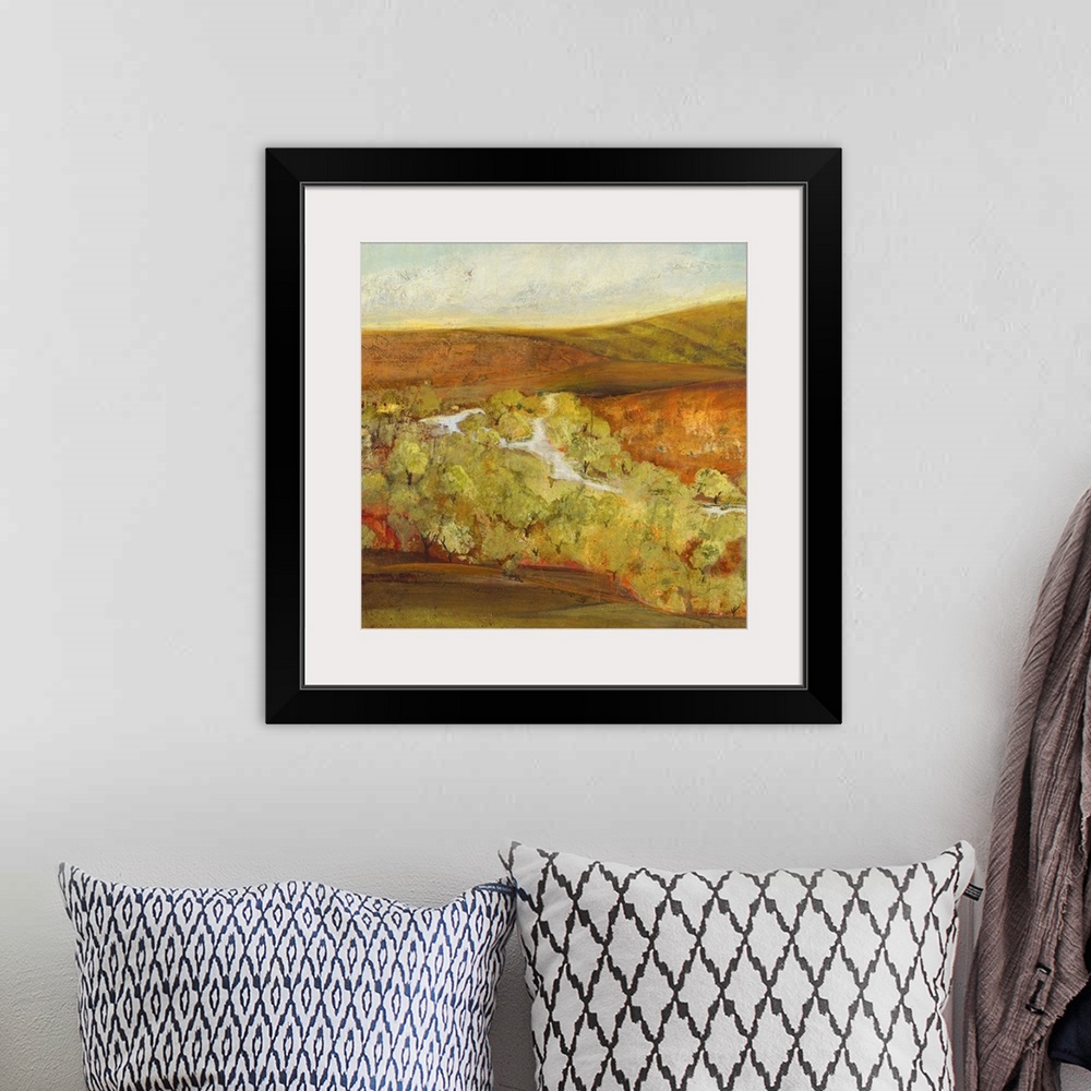 A bohemian room featuring Contemporary landscape painting looking out over autumn countryside.