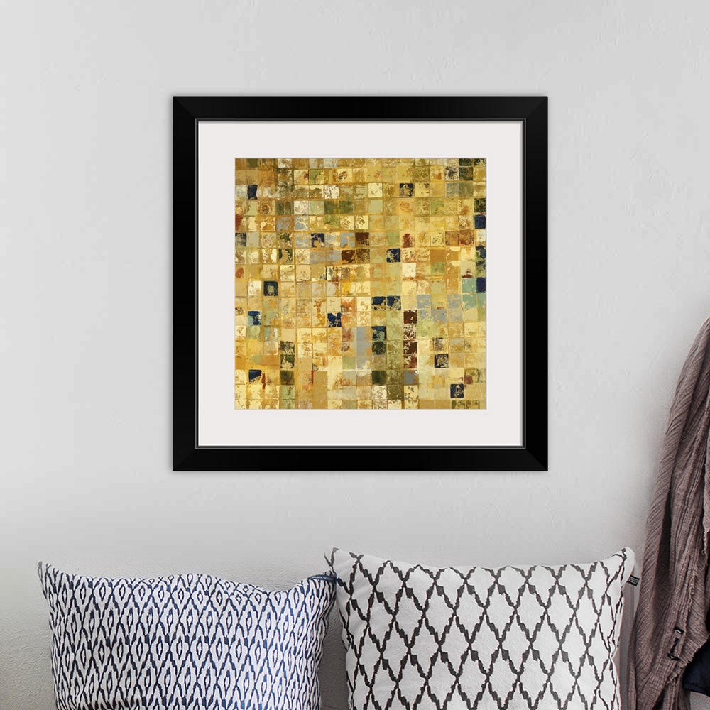 A bohemian room featuring Home decor artwork of a gold and earth toned mosaic.