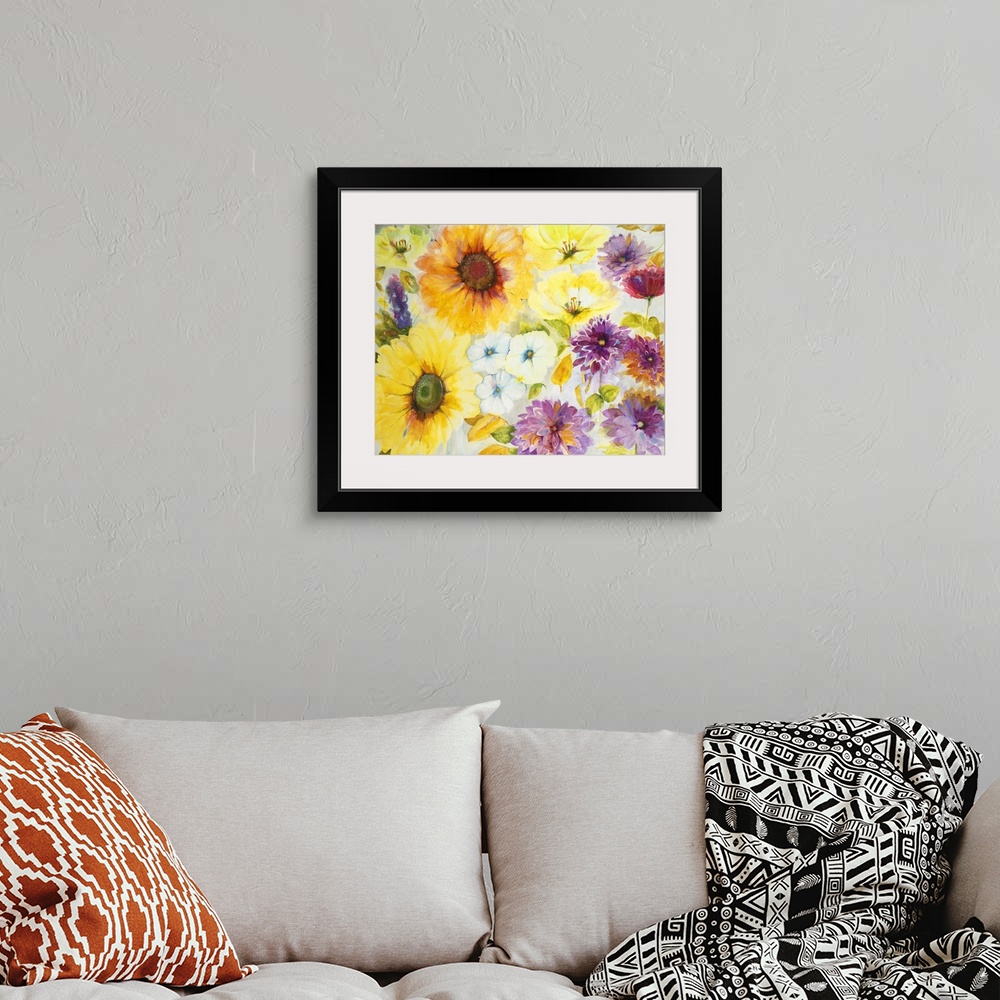 A bohemian room featuring A painting of vibrant yellow and purple garden flowers.