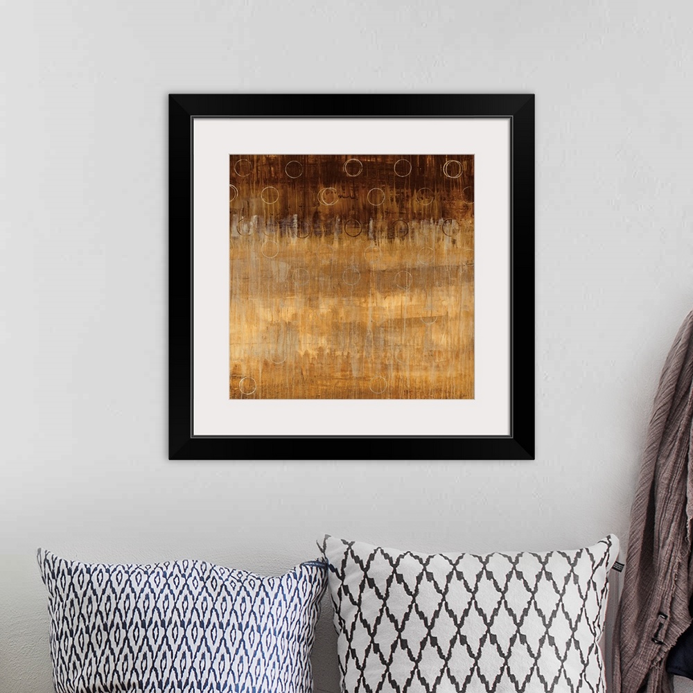 A bohemian room featuring Abstract painting on a square canvas of circles drawn over top of an earth toned gradient.