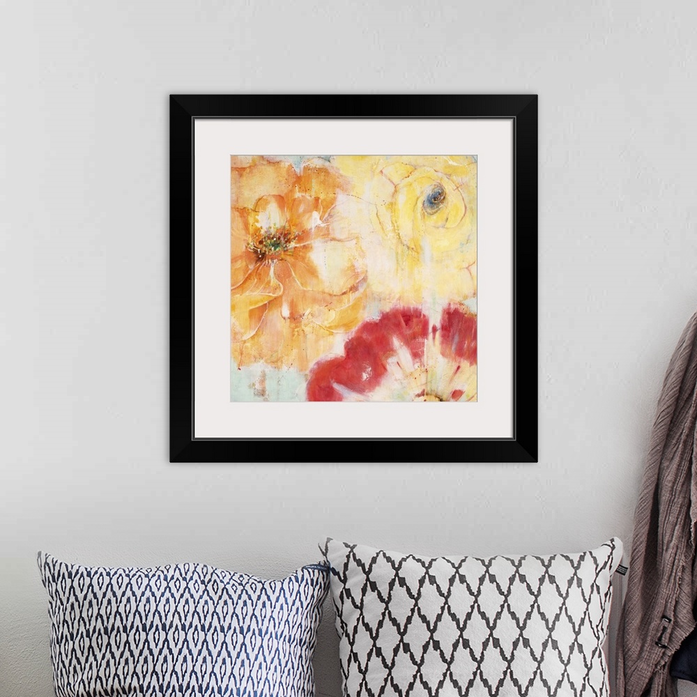 A bohemian room featuring Contemporary painting of vibrant red orange and yellow flowers close-up.