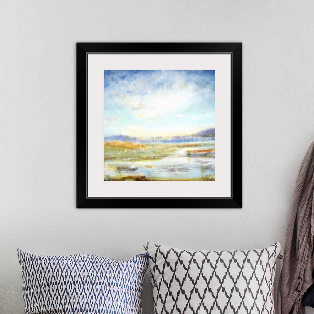 A bohemian room featuring Contemporary landscape painting looking out over wetlands under a vibrant blue sky.