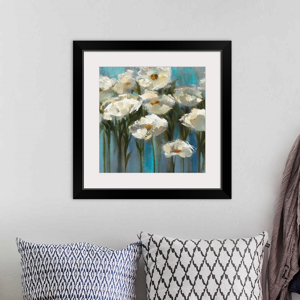 A bohemian room featuring Contemporary floral painting of blooming white flowers and stems sticking up on a texture cool ba...