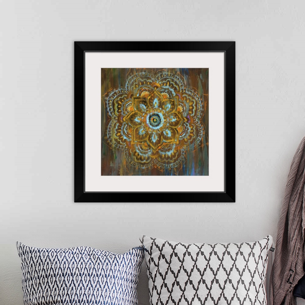 A bohemian room featuring Square abstract painting of a flower mandala with blue, orange, yellow, and brown hues and hints ...