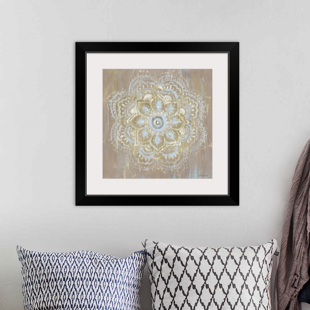 A bohemian room featuring Square decorative artwork of a Mandala style circle on a textured brown background.