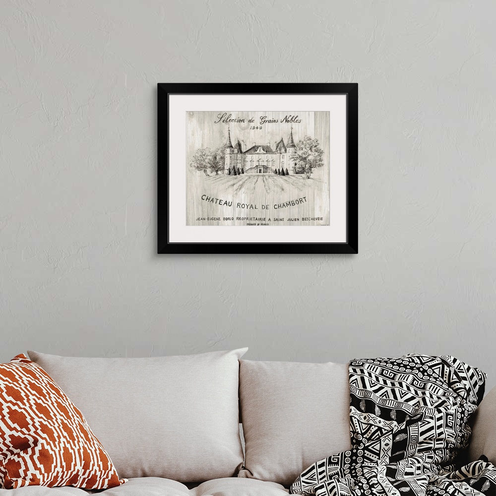 A bohemian room featuring Gray and white sketch of the Chateau Royal De Chamborat vineyard on wood panels.
