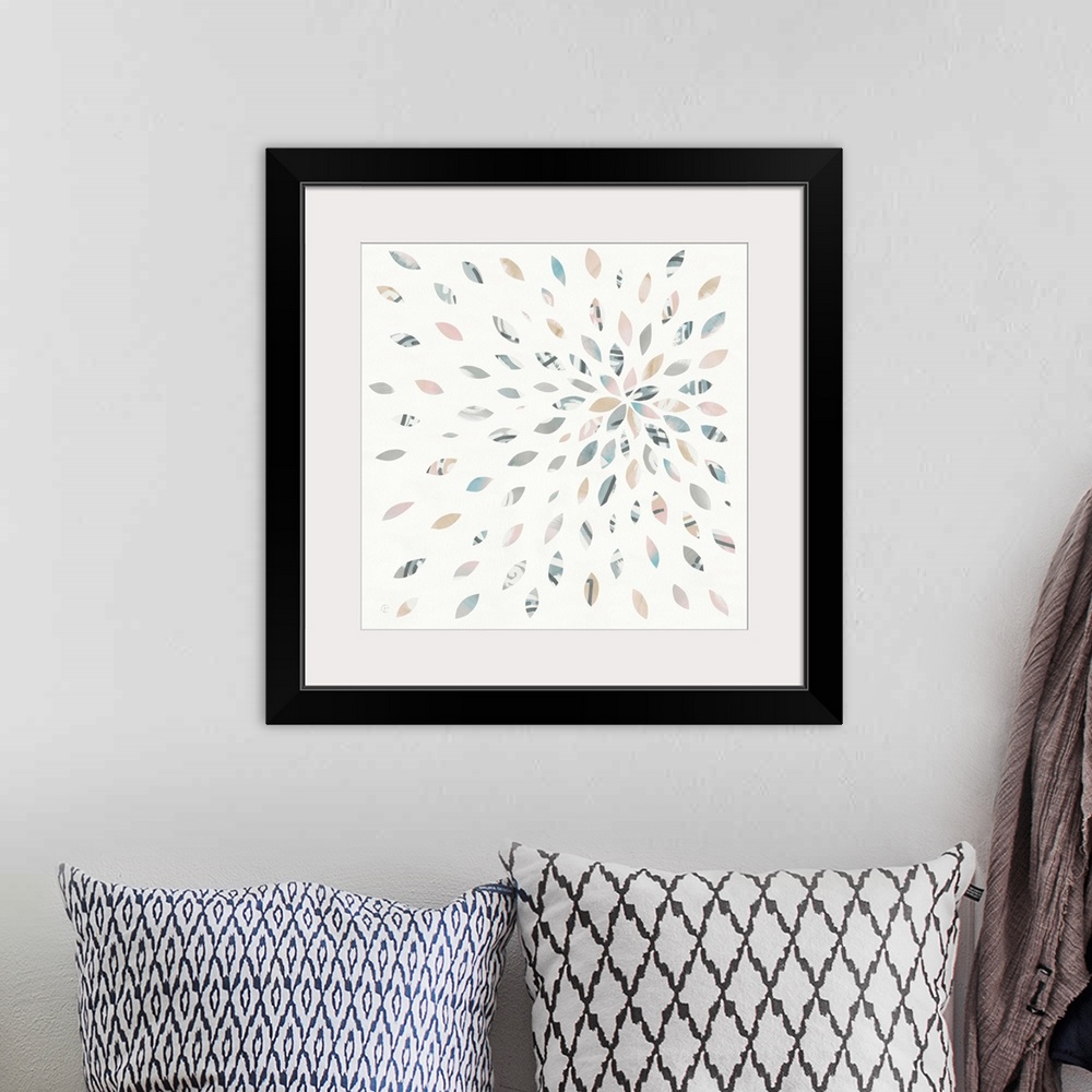 A bohemian room featuring Square watercolor painting with oblong shaped pieces creating a starburst firework design.