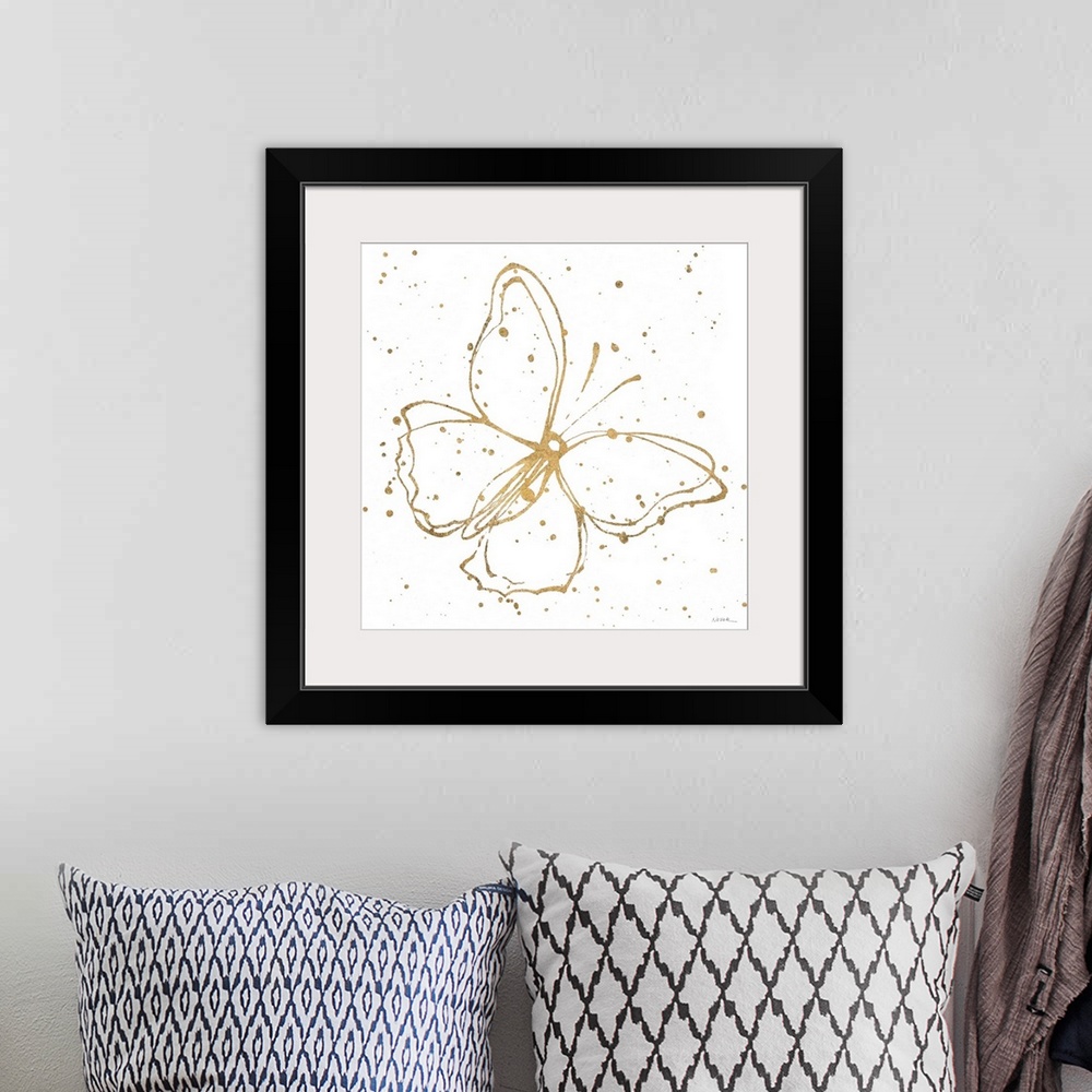 A bohemian room featuring Square painting of a metallic gold butterfly with paint splatter on a solid white background.